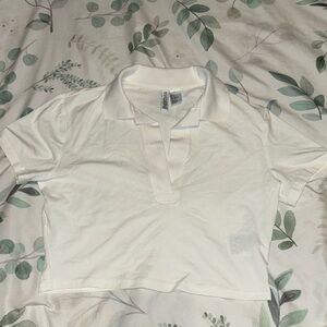 White cropped T-shirt deep V loose fitting.